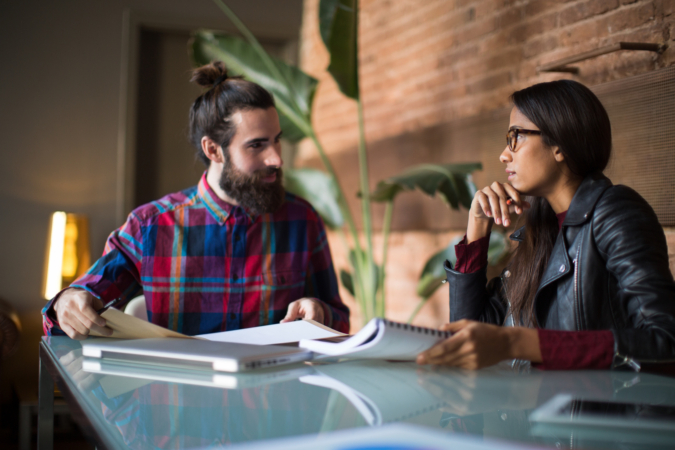 Two business people at a meeting.